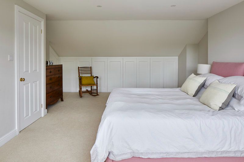 Dormer loft bedroom with massive built-in storage in a Nunhead Victorian house
